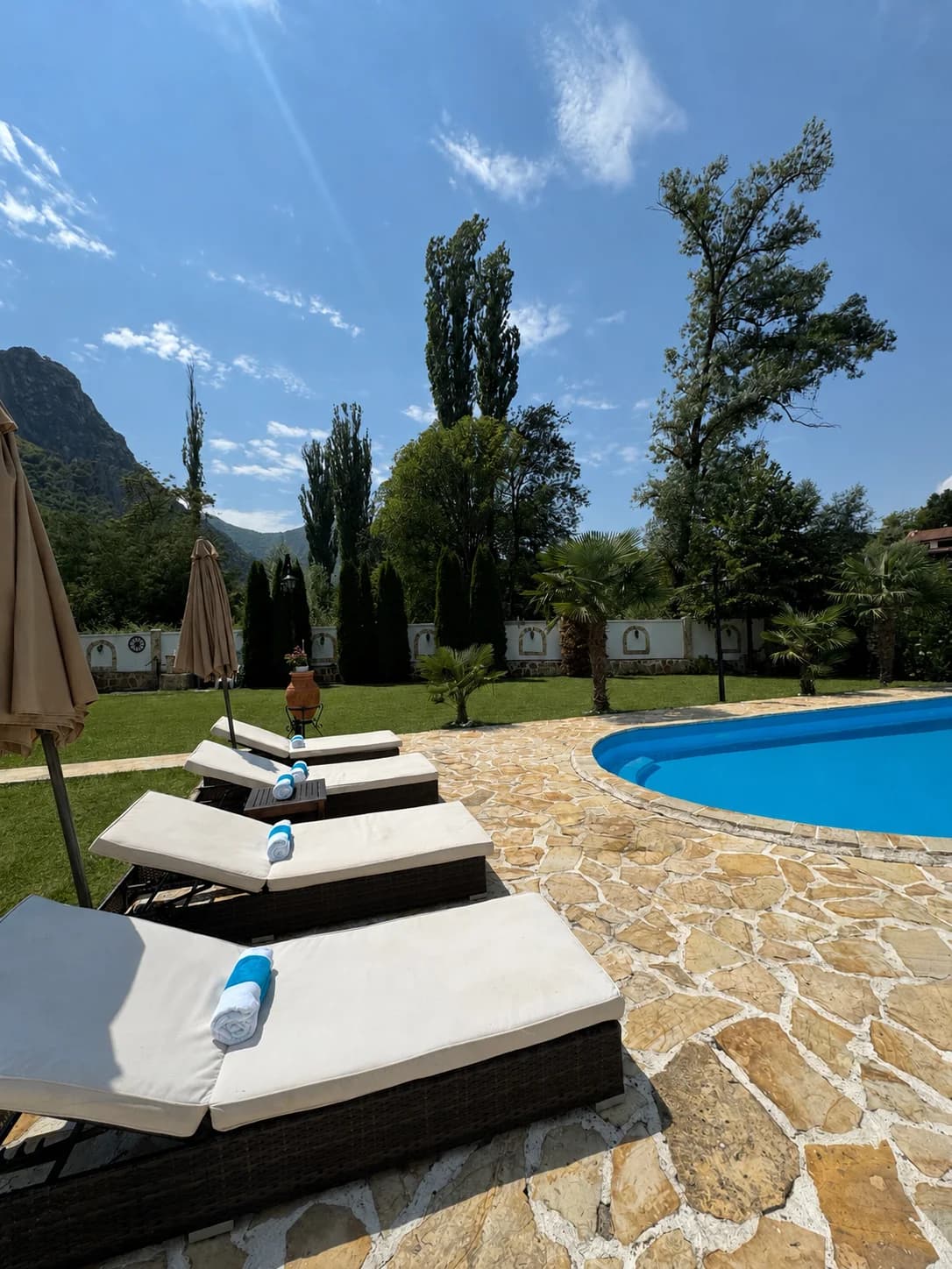 Sun loungers beside the private pool