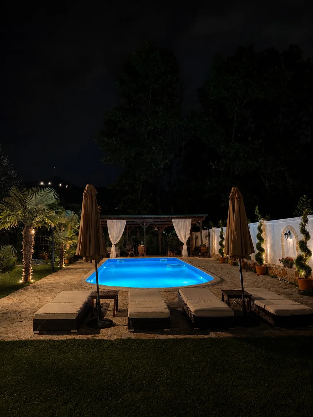 Illuminated swimming pool in the evening